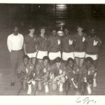 Clayton far left as the coach of the junior varsity basketball team at Wakefield.