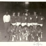 Clayton far left as the coach of the junior varsity basketball team at Wakefield.