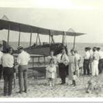 Marcey bi-plane with group of people at Arlington Beach in 1918 (AHS 0324)