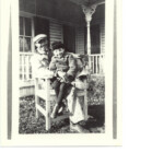 Mr. Marcey with son in front of their home in 1921 (AHS 0339)