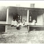 Marcey family on the porch at the log cabin home on Glebe Road in 1915 (AHS 0456)