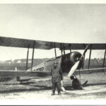 Mr. Marcey in front of a biplane on Arlington Road in 1922 (AHS 0531)