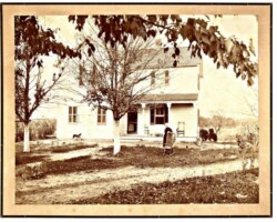 This is the home built by George W. Veitch which still stands on North Jefferson Street. This is a photo of what was originally the front of the house but now is the left side as you look from Jefferson Street. A porch was added many years ago to the new front. Margaret Johanna Birch Veitch can be seen next to the rocker and in the doorway was their daughter, Julia Veitch (Thomas).