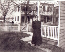 Allace B. Thomas, mother of Judge Harry R. Thomas, believed to be next to her house which was located where The Jefferson Assisted Living stands today in Ballston. Circa 1925.
